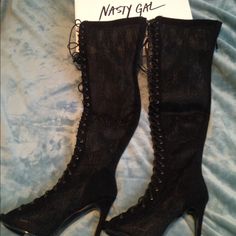 These Black Thigh-High Heels Feature Black Lace, Lace-Up Detailing At Front, An Open Toe, And Stiletto Heel. Zip Closure At Back, Partially Lined. Cushioned Insole. Pair Them With A Structured Shift Dress Or Your Favorite Pair Of Jeans. Fall Party Lace-up Knee-high Boots, Fall Party Knee-high Lace-up Boots, Lace-up Heels For Night Out, Fitted Boots For Night Out In Spring, Fitted Black Heeled Boots For Party, Fitted Knee-high Boots For Night Out, Edgy Lace-up Heeled Boots For Night Out, Edgy Fitted Heeled Boots For Evening, Fitted Edgy Heeled Boots For Evening