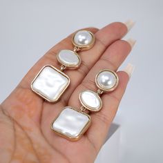 New to our Millennium collection. This beautiful Earring handmade with fine quality of Faux Pearls and beautifully made Fine quality of Metal for your special day. Even we have hard time taking pictures because of their shine 😄 so we want to shine our brides on their special days. The material used in these Earring are free from Lead, Nickel, Cadmium so it will not give you any skin irritation and environment friendly too.. The Earring Measures About 2.25 Inches Long and 0.8 Inches Wide ► ABOUT Party Pearl Drop Alloy Jewelry, Elegant Alloy Earrings As Gift, Elegant Alloy Earrings For Gift, Elegant Alloy Clip-on Earrings For Party, White Dangle Alloy Earrings, White Alloy Dangle Earrings, White Alloy Drop Earrings, White Alloy Jewelry With Pearl Drop, Elegant Alloy Earrings For Wedding