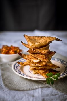 a stack of fried food sitting on top of a plate