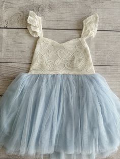 ♥ Product Information 100% Cotton in bodice and lining 100 % polyester tulle skirt Do not bleach Color is a Off White for the top and light blue for the tutu   This little girls party dress is perfect for any occasion, whether it would be for weddings flower girls dress, birthdays dress, Christmas gift, Easter dress, play wear and etc! Toddler tutu dress 's elastic back has a small loop to tie the strap crossover, adjust the length accordingly for a comfortable fit Beautiful baby dress has 4 layers exquisite fine tulle on the skirt with cotton lining to protect toddler girls gentle skin; Double layer front bodice with sweat heart front neck ;super full tutu is sure to make her stand out in a crowd Please measure chest and waist for a better fit, thank you so much for your understanding and Summer Lace Tutu Dress For Dress-up, Light Blue Tutu Dress For Spring Baptism, Light Blue Tutu Dress For Summer Dress-up, Blue Tulle Dress With Lace Trim, Princess Style Sleeveless Tutu Dress With Lace Bodice, Cute Sleeveless Tutu Dress With Tulle Skirt, Blue Sleeveless Tulle Tutu Dress, Light Blue Princess Sleeveless Tutu Dress, Summer Princess Dress With Lace Bodice