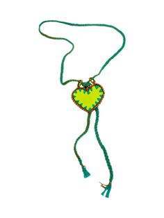 a green beaded heart necklace with tassels and beads on it's end