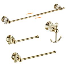 three brass bathroom accessories including two towel bars and one toilet paper holder with crystal knobs