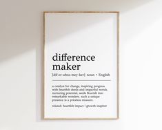 there is a framed poster on the wall with words in english and spanish that read'differences maker '