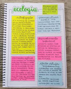 an open notebook with spanish writing on the pages and colorful sticky notes attached to it