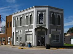 an old building on the corner of a street