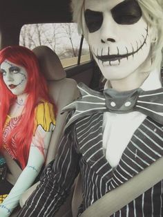 two people dressed up in halloween costumes sitting in a car