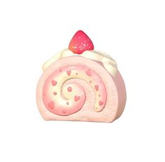 a pink and white cake shaped like a snail with a strawberry on it's top