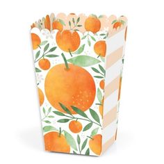 a paper bag with an orange pattern on the front and sides, decorated with leaves and stripes