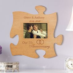 a wooden puzzle piece with an image of two people on it and the words, grace & anthony our 5th anniversary