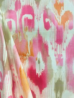 a pink and orange abstract print fabric