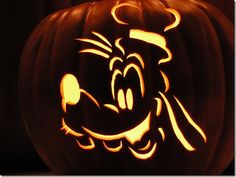 a carved pumpkin with an image of mickey mouse on it