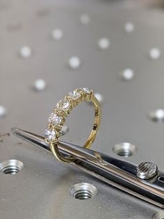 a close up of a pair of scissors with some diamonds on it's side