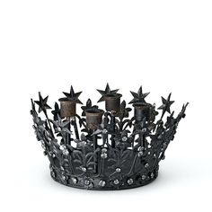 a metal crown with stars and flowers on it