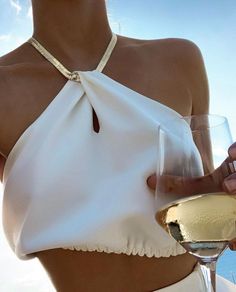 Gold Tank Top For Summer Club Events, Elegant Spaghetti Strap Crop Top For Beach, Elegant Tank Crop Top, Chic Summer Club Halter Top, Summer Evening Backless Crop Top, Elegant Beach Halter Crop Top, White Halter Neck Tank Top For Club, Chic Halter Neck Tank Top For Party, Backless Evening Crop Top For Summer