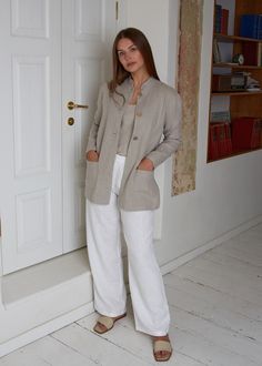 "Blazer in pure linen fabric for the everyday wear in cool summer day. That is most ecological outwear specially for you. You will feel and look cool in that linen blazer. Blazer with collar- stand, closed with three coconut buttons, two patched pockets on front and splits at side seams bottom. Blazer made from heavier linen fabric. Jacket center back length - 75cm (29,5\"), splits length - 17cm (6,75\"). Model on picture wears jacket in natural undyed flax of size S CARE * Machine wash (40 oC/ Casual Beige Linen Blazer, Beige Linen Blazer With Lapel Collar, Beige Linen Blazer With Relaxed Fit, Linen Blazer For Everyday Spring Wear, Everyday Linen Blazer For Spring, Spring Linen Blazer For Everyday Wear, Cream Linen Outerwear For Work, Everyday Linen Outerwear With Lapel Collar, Neutral Linen Outerwear For Work