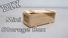 a wooden box with the words diy mini storage box