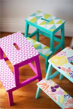 three colorful children's stools on the floor