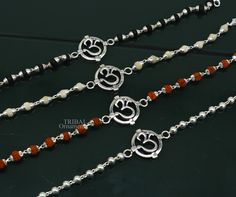 This amazing silver Rakhi crafted from 925 silver with immense precision. It exudes excellent craftsmanship and will surely look wonderful on your brother's wrist. handmade custom design Aum or OM Bracelet Or Rakhi bracelet with silver, rudraksha and holy Basil Rosary beaded chain, this is special design beaded bracelet we can use either Rakhi bracelet or daily use bracelet for unisex. Best Rakshabandhan Festival best wishes sibling gift for your brother and sister's , buyer can be select bracel Silver Bracelet For Puja And Festivals, Symbolic Sterling Silver Bracelets For Festivals, Spiritual Oxidized Finish Bracelets For Festivals, Spiritual Bracelets With Oxidized Finish For Festivals, Spiritual Oxidized Bracelets For Festivals, Symbolic Bracelet Jewelry For Puja, Silver Round Beads Jewelry For Puja, Symbolic Silver Bracelets With 8mm Beads, Silver Beaded Bracelets With Round Beads For Festivals