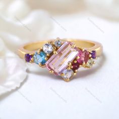 Emerald Cut Pink Sapphire Cluster Ring Multi Gemstone Engagement Ring 18K Yellow Gold Jewelry Art Deco Bridal Ring Anniversary Gift For Wife Description: Main Stone - Sapphire Stone Size - 7 x 5 MM Stone color - Pink Main Stone creation - Lab Created Stone shape - Emerald  Birthstone - September Secondary Stone - Multi Gemstone (Ruby, Aquamarine, Topaz, Amethyst) Stone Color - Multi Color Stone Shape - Round Finishing- Excellent feel free to contact me if you have any questions  Gemstone color may slightly vary from listed image due to the nature of all natural gemstone or different monitor settings TURNAROUND TIME Your order will be ready for shipment in 4-8 business days. Free economy shipping for US, UK, Germany- 10-15 business days delivery time. shipping upgrade available for US, UK, Multi Stone Engagement Rings, Elegant Multicolor Amethyst Ring For Anniversary, Pink Multi-stone Amethyst Ring Gift, Elegant Multicolor Cluster Ring As Gift, Elegant Multicolor Cluster Ring For Gift, Gold Sapphire Ring With Multi-stone Cubic Zirconia, Gold Multi-stone Birthstone Ring, Pink Multi-stone Cluster Ring As A Gift, Gold Multi-stone Topaz Ring