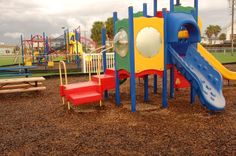 children's play area with slide and climbing equipment