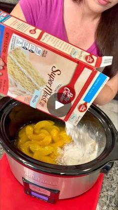 a woman pouring rice into an electric pressure cooker with noodles in it and a carton of pasta on the side