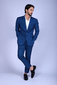 Stand apart from the crowd with this stunning blue blazer and trouser set. Made in premium blended fabric, it is tailored in a regular fit for a neat look, while the trendy solid fabric makes it evergreen wear. Team it with a White shirt and black oxford shoes to achieve that stunning look. Teal Blue Suit, Men Suit Design, Types Of Suits, Stylish Mens Suits, Suit Stores, Black Oxford Shoes, Most Stylish Men, Suits Online Shopping, Corporate Wear