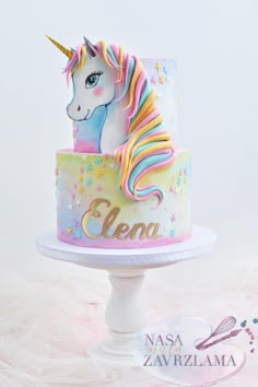 a unicorn cake on a white pedestal with the name gena on it and an embellishment