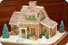 a gingerbread house is decorated with candy canes