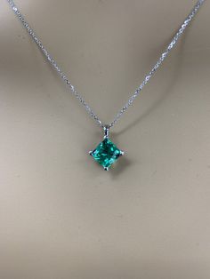 "This necklace is cushion cut lab created emerald ladies necklace, 18\" cable chain, 14k white gold #6160 Emerald is the birthstone of May -Stone Size: approx. 1.75 ct diamond equivalent -Stone Shape: Cushion cut 7x7mm -Gem Type: lab created emerald -Stone Clarity: VS2 -Stone Color: lively medium green, eye-clean -Moh's Scale: 8.5 hardness -Metal Type and Purity: 14k white gold -Setting: 4 prong open u -Country of Manufacturing: USA (Michigan) For customization please contact us. If you have any Cushion Cut Birthstone Jewelry For Anniversary, Cushion Cut Birthstone Jewelry Gift, Cushion Cut Birthstone Jewelry For Gifts, Silver Cushion Cut May Birthstone Jewelry, Formal Jewelry With May Birthstone In Square Pendant Shape, Green Cushion Cut May Birthstone Jewelry, Green Cushion Cut Jewelry For May Birthstone, Cushion Cut May Birthstone Jewelry With Prong Setting, Classic Cushion Cut Birthstone Jewelry