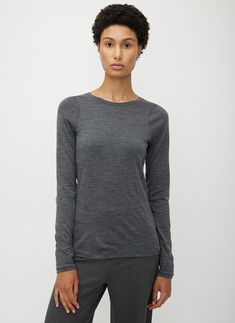 A cozy long-sleeve crewneck made for effortless layering. Designed to hug close to the body, it's crafted from super soft and insulating Merino wool with a high neck and extra long sleeves, making it the perfect base layer for cold days. With dependable construction features like flattering contouring seams and shoulder darts, this style offers quality you'll feel. Plenty of stretch keeps you moving forward, even in harsh conditions. Wool Base Layer, Kit And Ace, Extra Long Sleeves, Base Layer, Long Sweaters, Moving Forward, Cold Day, Extra Long, Tank Shirt