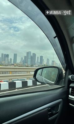 a view from inside a car looking at the city