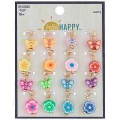 an assortment of key chains with flowers and butterflies on them