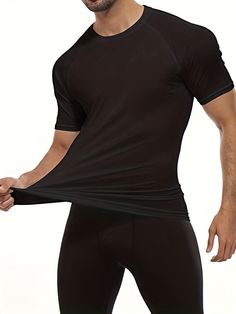 Introducing our Men's 4Pack Solid Stretch Compression Workout Shirts, designed to enhance your performance and comfort during any workout or sports activity. These shirts are made with a high-quality polyester material that provides medium stretch and a skinny fit, perfect for adult athletes all year round. Benefits of our Men's 4Pack Solid Stretch Compression Workout Shirts: Boost your performance with the compression technology that supports your muscles and reduces fatigue Stay comfortable during intense workouts with the breathable and moisture-wicking fabric Look stylish with the solid color design that is perfect for any sports scene Easily care for your shirts with machine wash instructions and enjoy the durability of the knit fabric Experience a flattering fit with the crew neck an Fitted Dri-fit T-shirt With Moisture-wicking, Breathable Black Workout T-shirt, Black Sweat Resistant T-shirt For Workout, Functional Black Sports T-shirt, Technical Black Workout T-shirt, Solid Sportswear T-shirt For Sports, Dri-fit Crew Neck Activewear For Training, Black Breathable Short Sleeve Activewear, Black High-stretch Sports T-shirt