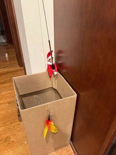 the elf is trying to figure out what's in the box