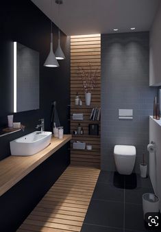 a modern bathroom with wood flooring and black walls