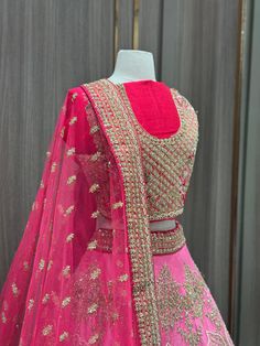 1. Pink ombre raw-silk lehenga features intricate details with multi-color resham, zardozi, sequins, and crystal embroidery. 2. Complete the ensemble with the included hot pink unstitched blouse and Net dupatta 3. Ready to ship ! Party Wear Embroidered Lehenga In Raw Silk, Party Wear Raw Silk Choli With Intricate Embroidery, Pink Raw Silk Traditional Wear With Dori Work, Party Wear Embroidered Tissue Silk Lehenga, Bollywood Style Embellished Tissue Silk Lehenga, Pink Traditional Wear With Dori Work, Pink Raw Silk Fabric With Zari Embroidery, Festive Pink Silk Thread Traditional Wear, Festive Pink Traditional Wear In Silk Thread