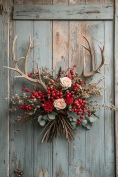 a deer's head with flowers and antlers is mounted on the side of a door