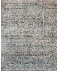 an area rug with various colors and patterns on the carpet, including blue, beige, gray