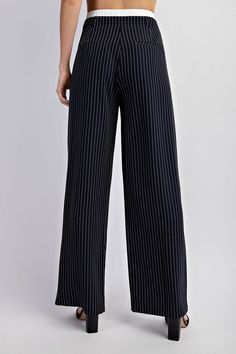 Expertly crafted pinstriped woven trousers with a contrast elastic waistband for a comfortable and tailored fit. Perfect for any professional setting, these beige trousers elevate your style with a touch of sophistication. Fabric & fit: 97% polyester, 3% spandex Model is wearing size Small. Swimwear Sale, Tailored Trousers, Polished Look, Navy White, Navy And White, Woven Fabric, Elastic Waist, Trousers, Spandex