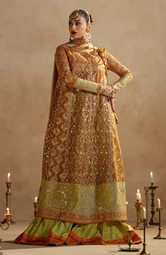 Mustard Royal Style Pakistani Wedding Dress Kameez Heavy Flare Sharara is an epitome of tradition and royalty. Hand-crafted embellishments on this stunning attire make it your foremost priority to have your desired dreamy appearance on the Mehndi day. Embroidered Kameez: The beautiful Kameez in the Mustard shade is hand-embellished with lavish embroidery details. The luxury designs and premium fabric of this Kameez make it a perfect choice to have a stylish and traditional look on Mehndi. Beads, Unstitched Embroidered Tissue Silk Sharara, Luxury Resham Embroidered Jamawar Dupatta, Semi-stitched Organza Fabric With Dabka Embroidery, Resham Embroidered Organza Dupatta, Semi-stitched Resham Embroidered Tissue Silk Fabric, Pakistani Boutique, Pakistani Bridal Dress, Pakistani Wedding Dress, Embroidered Sleeves