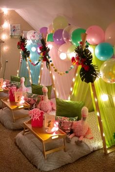 a room filled with lots of balloons and decorations