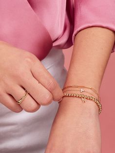 We can’t get enough of the paperclip trend! Our extra-small link style introduces a dainty new chain to your collection, and is part of our fine Paperclip Collection made of 14K gold. Mix and match with different sizes and pieces from the collection for especially on-trend stack. Modern Yellow Gold Charm Bracelet For Everyday, Trendy Everyday Yellow Gold Bracelet, Dainty Yellow Gold Oval Link Chain Bracelet, Gold Minimalist Paperclip Bracelet, Everyday Gold Plated Satellite Chain Bracelet, Everyday Gold Plated Chain Bracelet With Satellite Chain, Gold Minimalist Paperclip Bracelet For Everyday Luxury, Dainty Stackable 14k Gold Filled Chain Bracelet, Trendy 14k Yellow Gold Filled Chain Bracelet