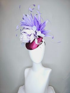 From the 2024 Featured Milliner of the Kentucky Derby Museum  Gorgeous Kentucky Derby hat fascinator  kentucky derby hat fascinator purple magenta satin with lavender flower with purple feathers beaded flower decor headband attachment.  each hat is totally one of a kind! no two are alike! * I can add feathers or flowers to any existing hat to help customize your look for a small fee. Message me for requests, I am happy to help!  *All hats are sold as displayed. No returns do to nature of product Luxury Purple Mini Hats For Races, Purple Feathered Headpieces, Purple Fascinator With Handmade Flowers For Parties, Purple Party Fascinator With Handmade Flowers, Purple Handmade Flowers Fascinator For Party, Elegant Purple Feathered Headpiece, Purple Headpieces For Spring Races, Purple Headpiece With Handmade Flowers For Kentucky Derby, Purple Handmade Flowers Headpiece For Kentucky Derby