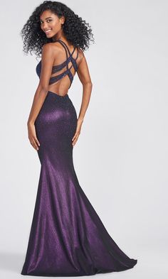 a woman wearing a purple dress with an open back and cutout at the top