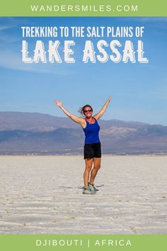 a woman standing in the sand with her arms outstretched and text reading trekking to the salt plains of lake assal