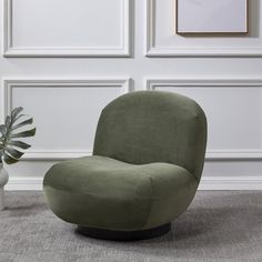 a green chair sitting on top of a carpeted floor