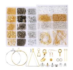 an assortment of gold and silver jewelry in plastic storage boxes with earring hooks, bracelets, earrings, rings, and more