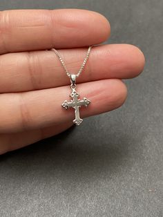 "Tiny Sterling Silver Cross CZ Necklace Minimalist and Dainty Metal: All components are made from solid .925 Sterling Silver Stone: Cubic Zirconia Measurement: pendant height is 21mm (0.83\") and 12mm (0.47\") wide Choose Chain Length At Checkout You can find other cross jewelry in my shop here https://www.etsy.com/shop/LinksAndStones?ref=seller-platform-mcnav&section_id=24376960 Please feel free to Convo me with any questions before purchasing. Please view policy before purchasing Thank You Sterling Silver Crucifix Necklace For Jewelry Making, Silver Cross Jewelry For Her, Dainty Sterling Silver Cross Jewelry, Silver Cross Jewelry As Gift For Her, Silver Sterling Silver Cross Necklace For Gift, Sterling Silver Cross Necklace Gift, Silver Cross Necklace Perfect As A Gift For Her, Silver Cross Necklace For Her, Silver Cross Jewelry Gift For Her