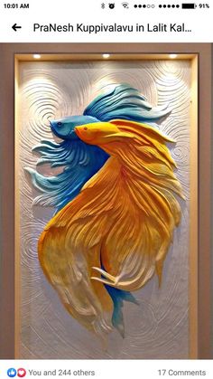 an image of a gold fish with blue and yellow colors