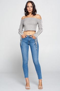 Stun in this Heather Grey/multi-tied sleeved top! Featuring sophisticate ties on the sleeves and with it's off the shoulder style, you are sure to turn heads when you pair it with some jeans and heels this season. Knit Open Shoulder Crop Top with beautiful side detail 50% Rayon/28% Polyester/22% Nylon Casual Stretch Cropped Off-shoulder Top, Stretch Cropped Off-shoulder Top For Fall, Cropped Stretch Off-shoulder Top For Fall, Stretch Cropped Off-shoulder Top For Spring, Spring Stretch Cropped Off-shoulder Top, Spring Cropped Off-shoulder Stretch Top, Tied Crop Top, Open Shoulder Top, Ibiza Outfits